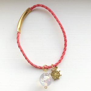 Coral braided leather ship’s wheel charm bracelet